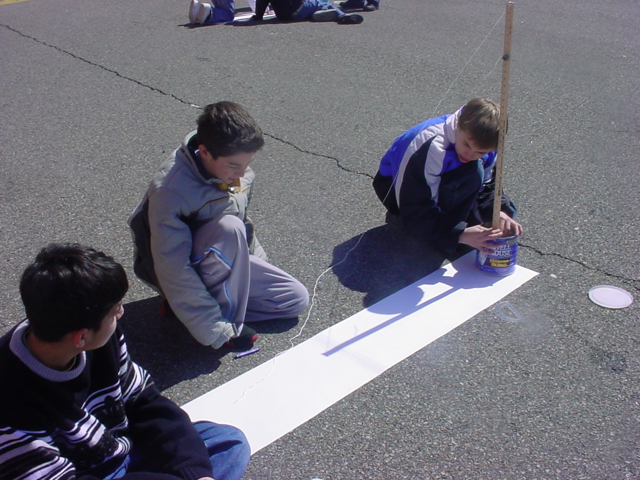 Sixth graders measuring for Noon Day.